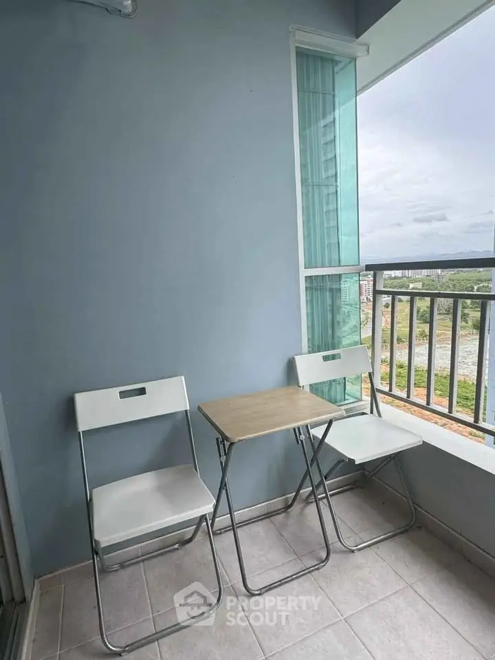 Charming balcony with seating and scenic view, perfect for relaxation and enjoying the outdoors.
