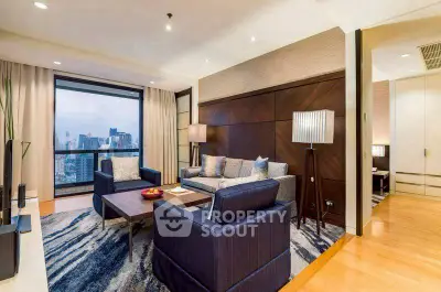 Luxurious living room with city view, modern furniture, and elegant decor.