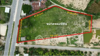 Aerial view of a large plot of land with boundary measurements.