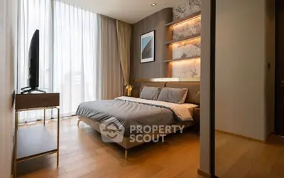 Luxurious modern bedroom with elegant decor and large window offering city views.