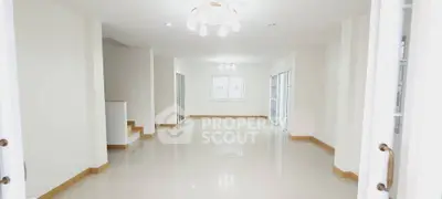 Spacious and bright living room with modern lighting and glossy floors