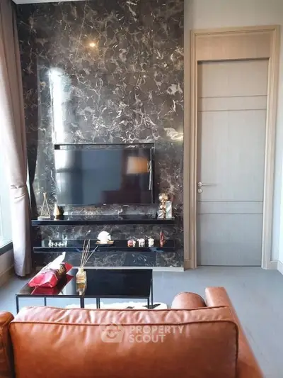 Luxurious living room with marble accent wall and modern decor