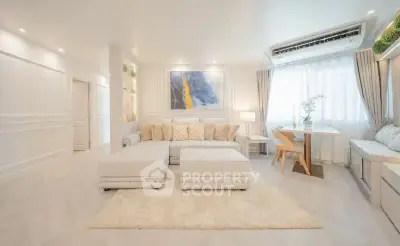 Elegant and spacious living room with modern decor and natural light