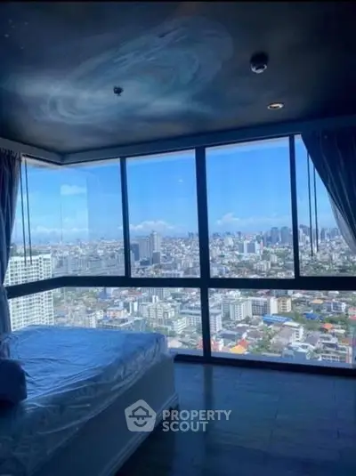 Stunning bedroom with panoramic city view and unique ceiling design.