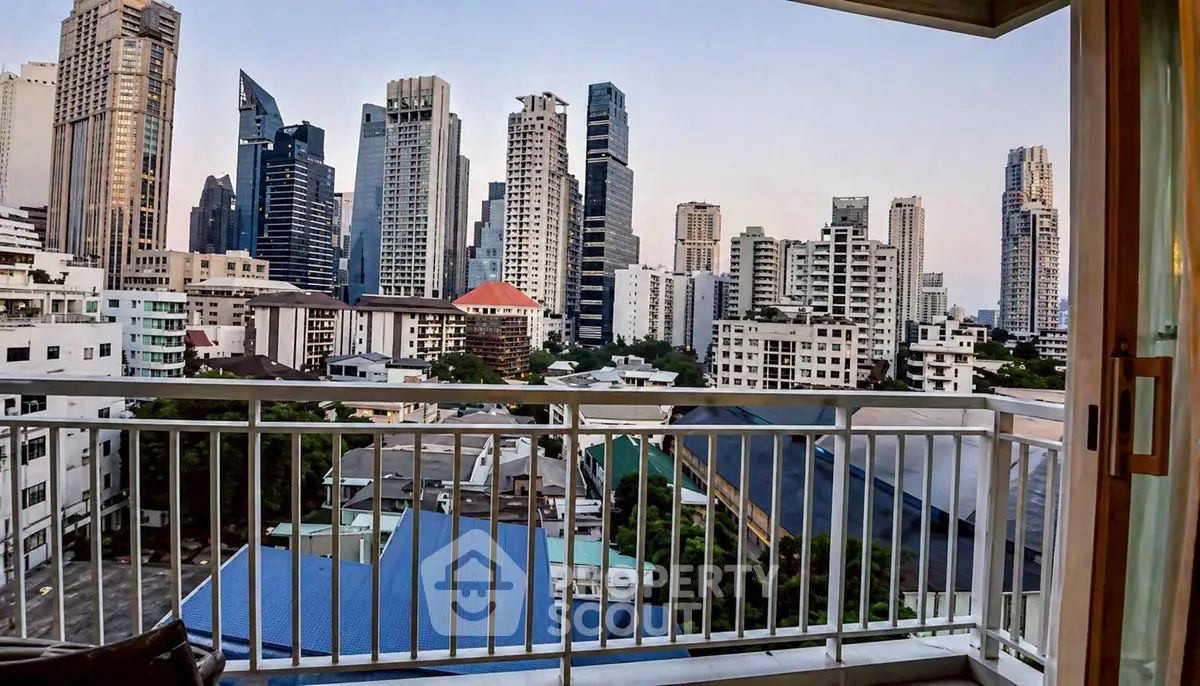 Stunning cityscape view from a modern balcony in a high-rise apartment.