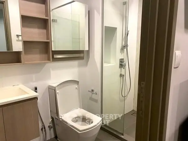 Modern bathroom with glass shower and sleek fixtures