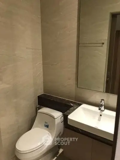 Modern bathroom with sleek fixtures and elegant design, perfect for contemporary living.