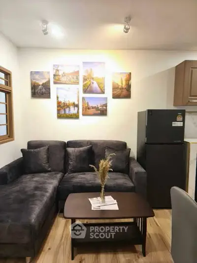 Cozy living room with modern sofa and stylish decor in a contemporary apartment.