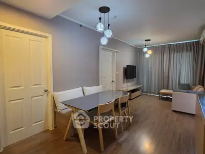 Modern living room with stylish lighting and wooden flooring