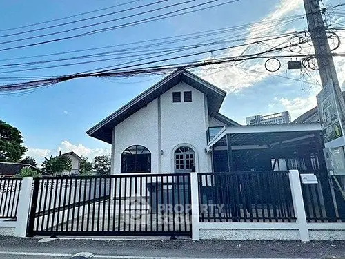 Charming suburban house with modern fence and spacious driveway