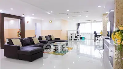 Spacious modern living room with sleek design and ample natural light