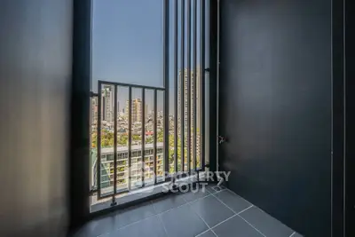 Stunning city view from a modern high-rise balcony with sleek design.