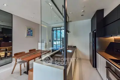 Modern kitchen with sleek design and open layout in luxury apartment