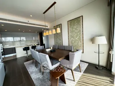 Luxurious modern dining room with elegant lighting and open kitchen layout