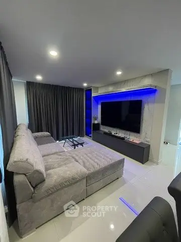 Modern living room with sleek design and ambient lighting