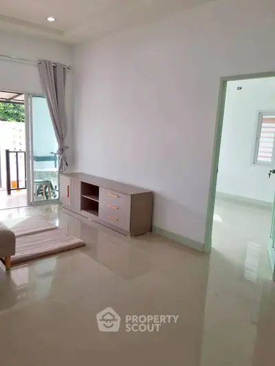 Bright living room with modern furniture and balcony access