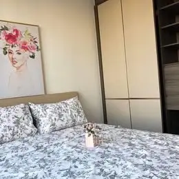Charming bedroom with floral decor and modern wardrobe
