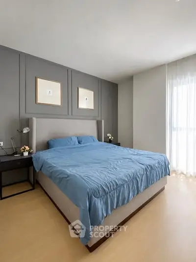 Spacious bedroom with modern decor and natural light