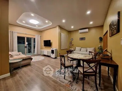 Spacious modern living room with elegant decor and cozy seating area.