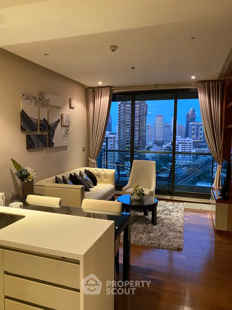 Luxurious living room with city view, elegant decor, and modern furnishings in a high-rise apartment.