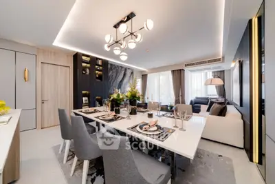 Luxurious modern dining and living room with elegant decor and ambient lighting