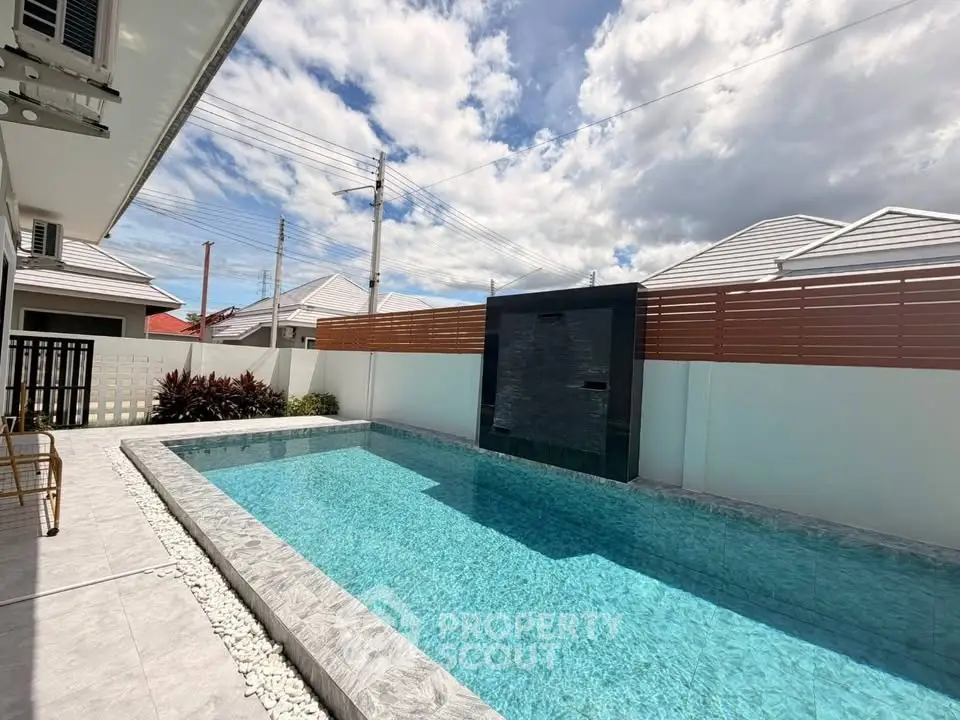 Luxurious private pool with modern design in a serene residential area, perfect for relaxation and entertainment.