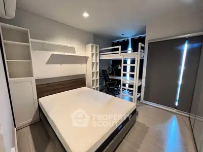 Modern bedroom with bunk bed and study area, perfect for maximizing space and functionality.