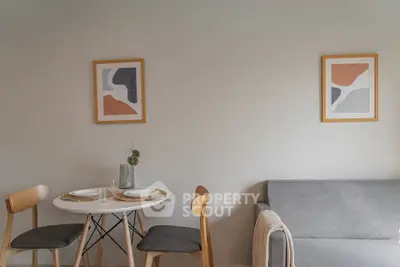 Cozy living room with modern dining set and stylish wall art