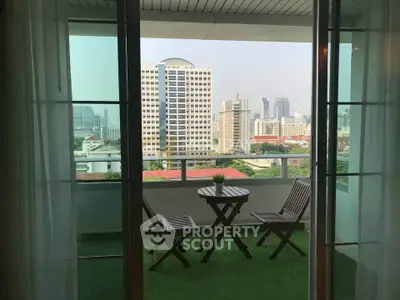 Charming balcony with city view, perfect for relaxation and enjoying the skyline.