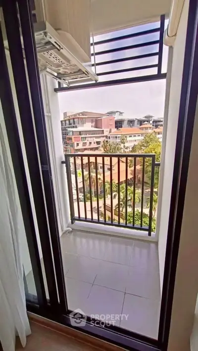 Charming balcony with city view, perfect for relaxation and enjoying the urban landscape.