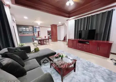 Spacious living room with elegant decor and open layout to dining area