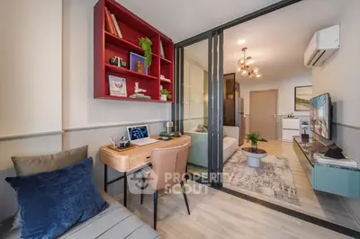 Modern study area with stylish decor and open view to living room in contemporary apartment.