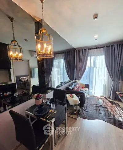 Modern living room with elegant dining area and large windows for natural light.