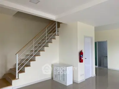Modern interior with staircase and sleek design, ideal for contemporary living.