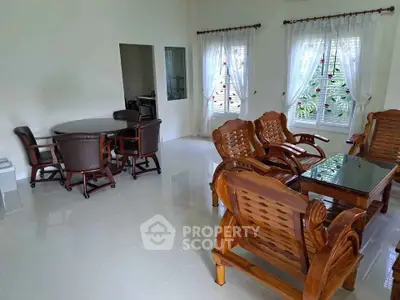 Spacious living room with elegant wooden furniture and natural light