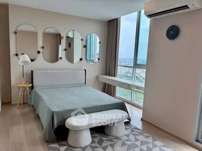 Modern bedroom with large windows and stylish decor in high-rise apartment.