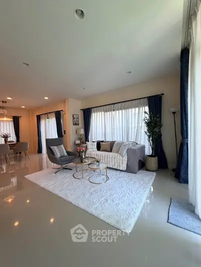 Spacious modern living room with elegant decor and natural light