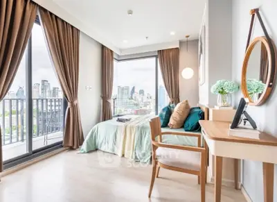 Modern bedroom with city view and stylish decor in high-rise apartment