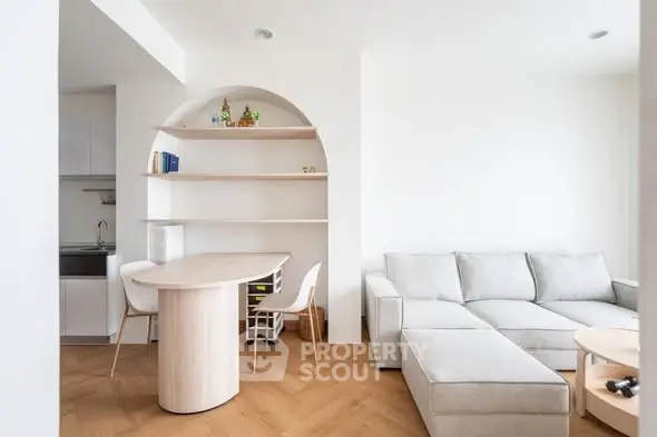 Modern living room with stylish furniture and open kitchen layout