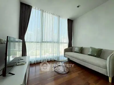 Modern living room with large window and stylish furniture in urban apartment.