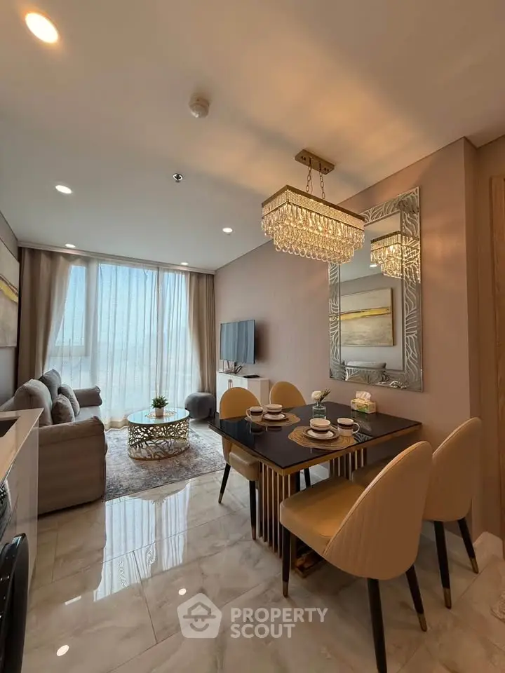 Luxurious modern living room with elegant dining area and chandelier, perfect for stylish urban living.