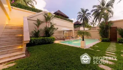 Luxurious tropical villa with private pool and lush garden, perfect for relaxation and entertaining.