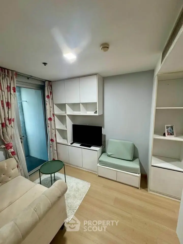 Cozy living room with modern furniture and built-in storage, perfect for urban living.