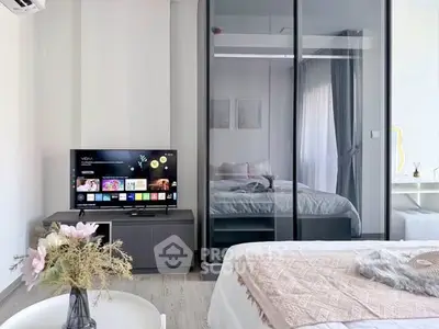 Modern bedroom with mirrored wardrobe and stylish decor