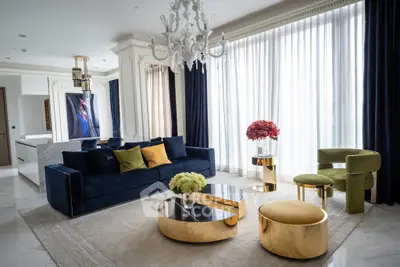 Luxurious living room with elegant decor, featuring a plush sofa, chic chandelier, and modern furniture.