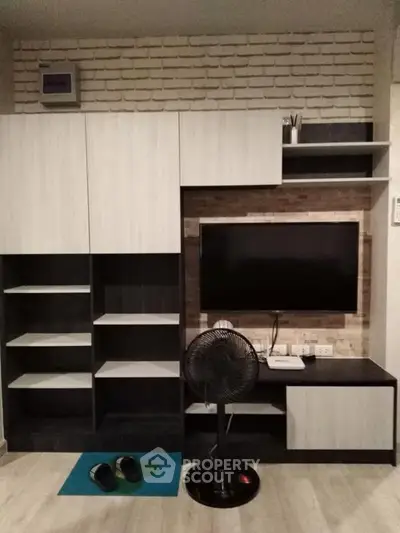 Modern living room with sleek TV unit and stylish shelving