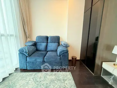 Cozy living room with plush blue sofa and modern decor