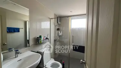 Modern bathroom with glass shower and sleek fixtures