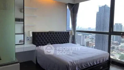 Luxurious bedroom with stunning city view in high-rise apartment