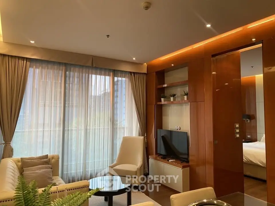 Luxurious living room with elegant decor and natural light in modern apartment